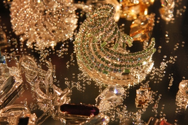 This photo of a display of miscellaneous pieces of jewelry - or jewellery - and loose gem stones and rhinestones was taken by Mihai Andoni of Bacau, Romania.